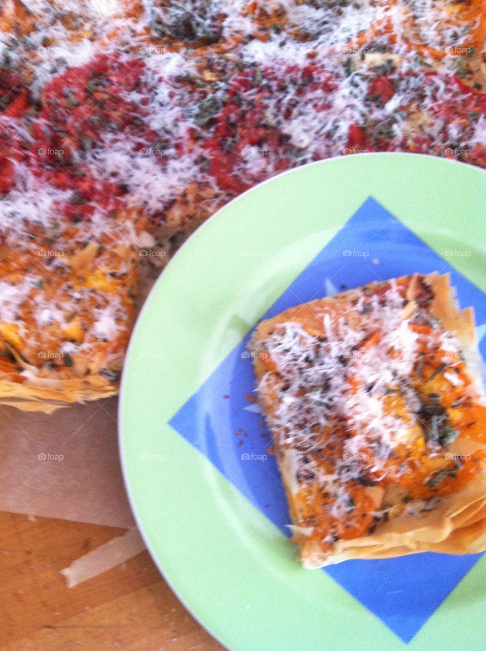 Tomato tart. Slice of tomato tart on a plate