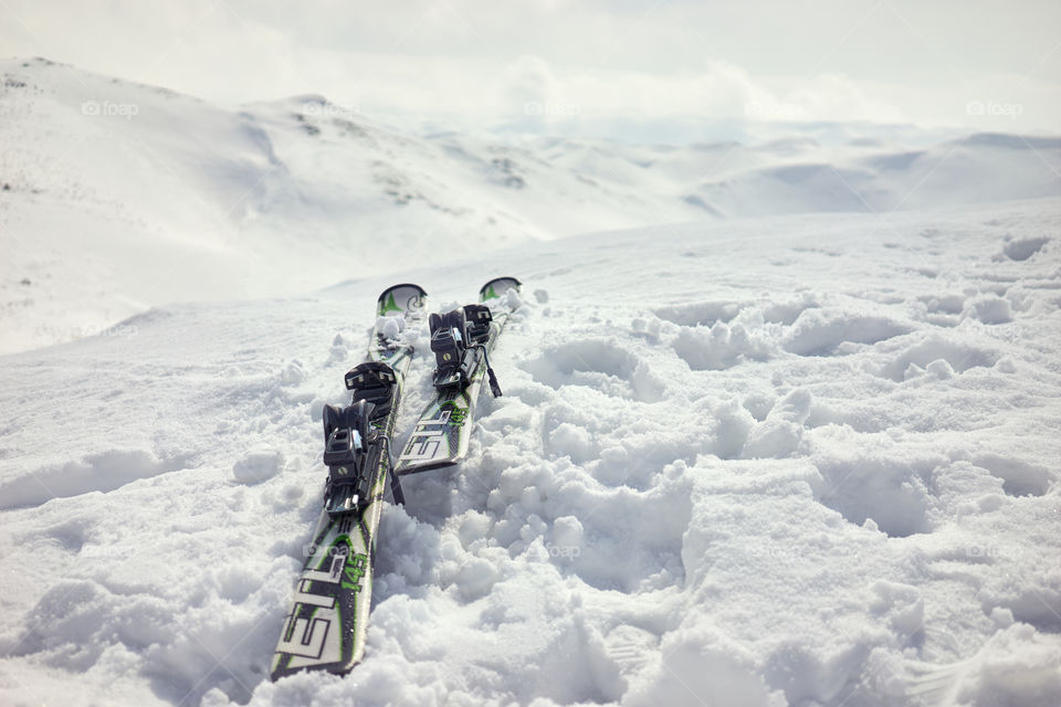 Mountain skis in snow