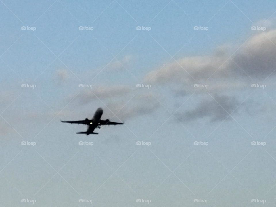 Beautiful airplane flying cross the sky