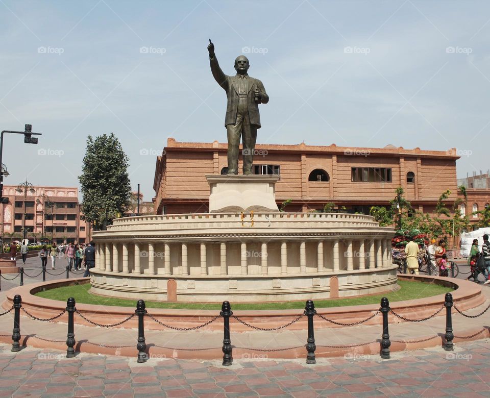 This inspiring photograph captures a statue of Dr. BR Ambedkar, a social reformer and statesman who fought for the rights and equality of all people. The dignified and powerful stance of the statue reflects the strength.