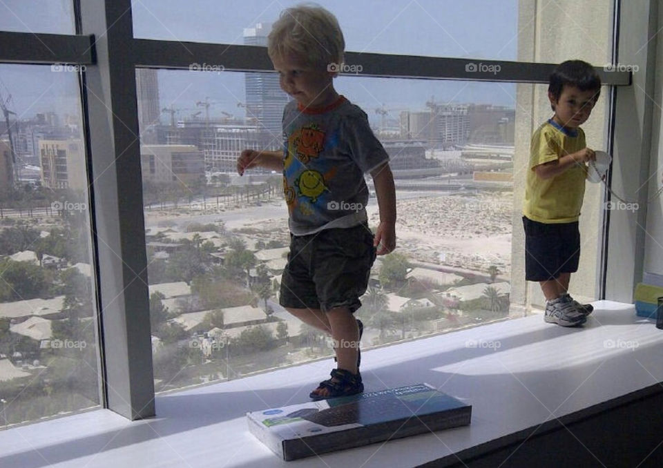 Dubai from office window enjoyed by toddlers