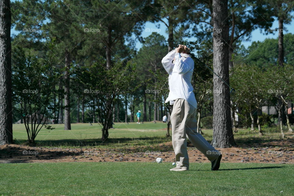 Man playing golf