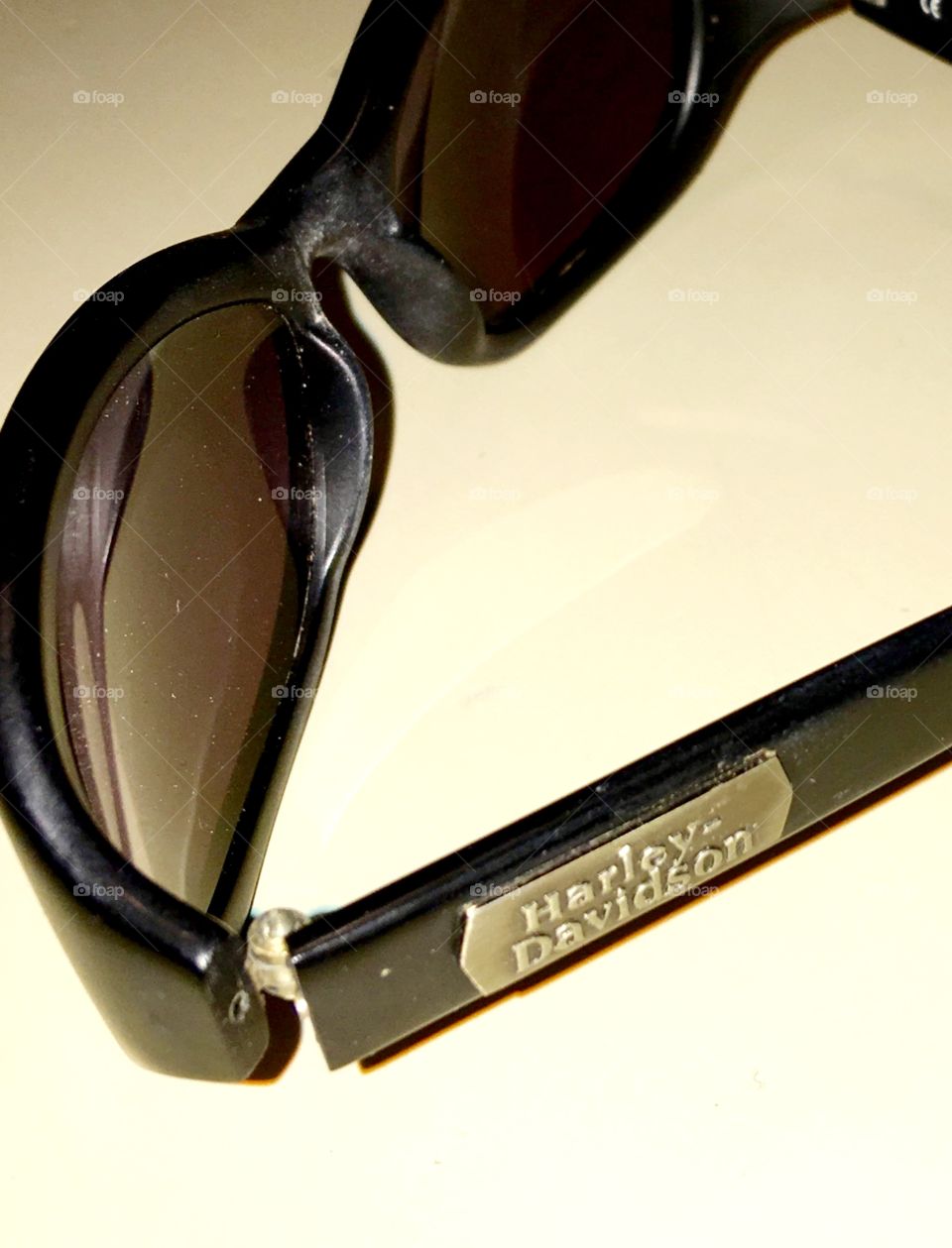 Harley-Davidson wrap riding sunglasses. These lighten & darken as the light changes, called Transition eyeglasses.