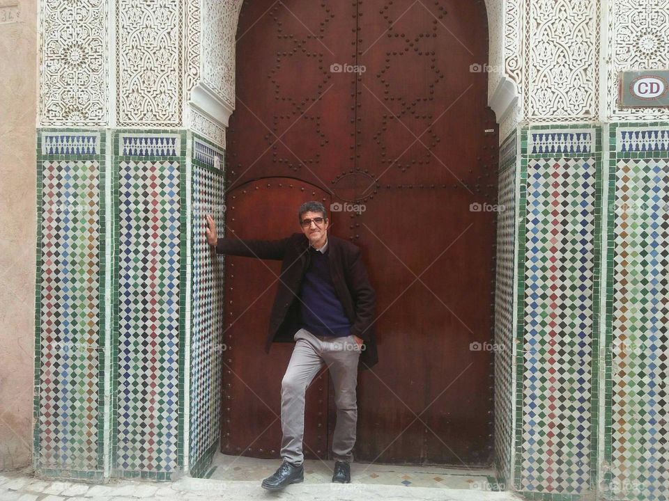 Im standing near an ancient door at marrakech city in Morocco.