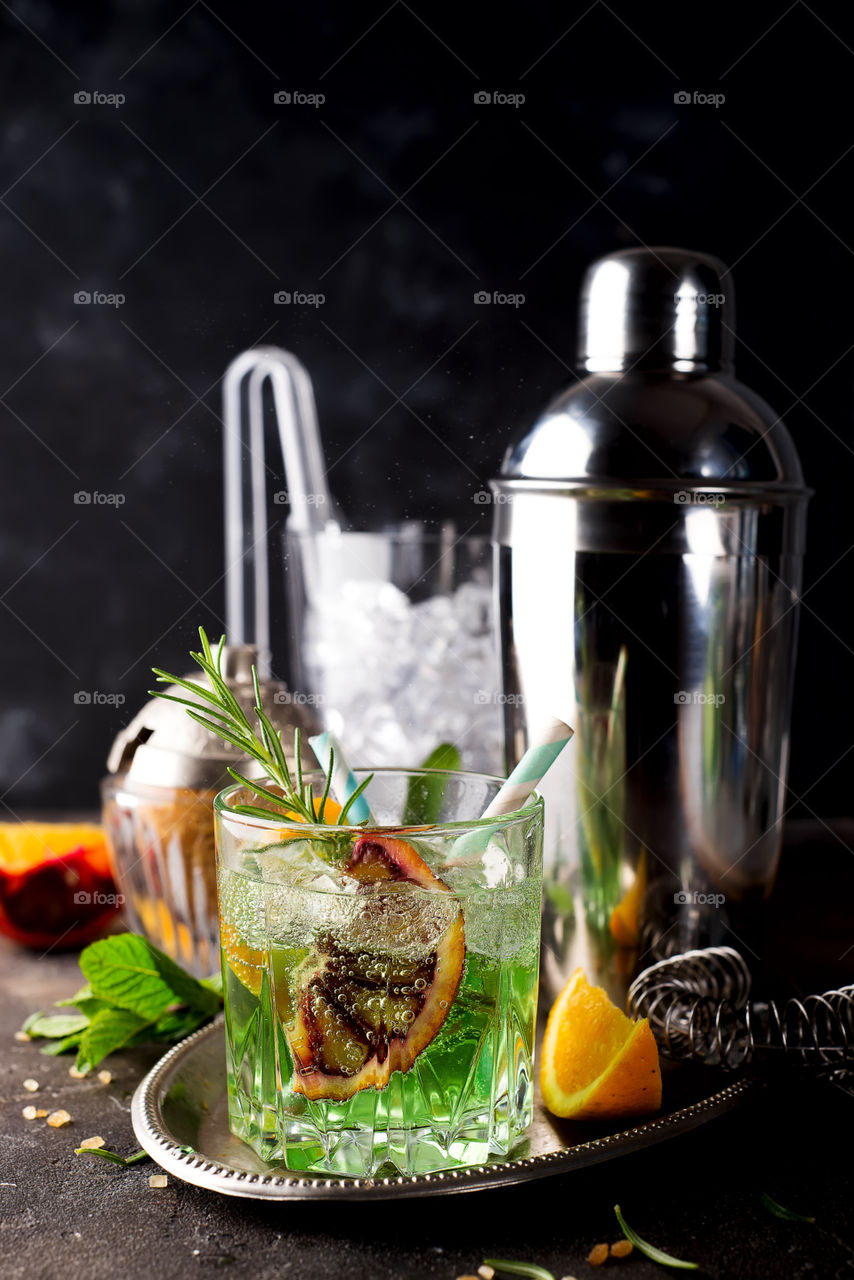 cold summer cocktail with ice and slice citrus