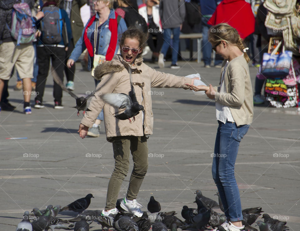 Playing with pigeons in Venice 