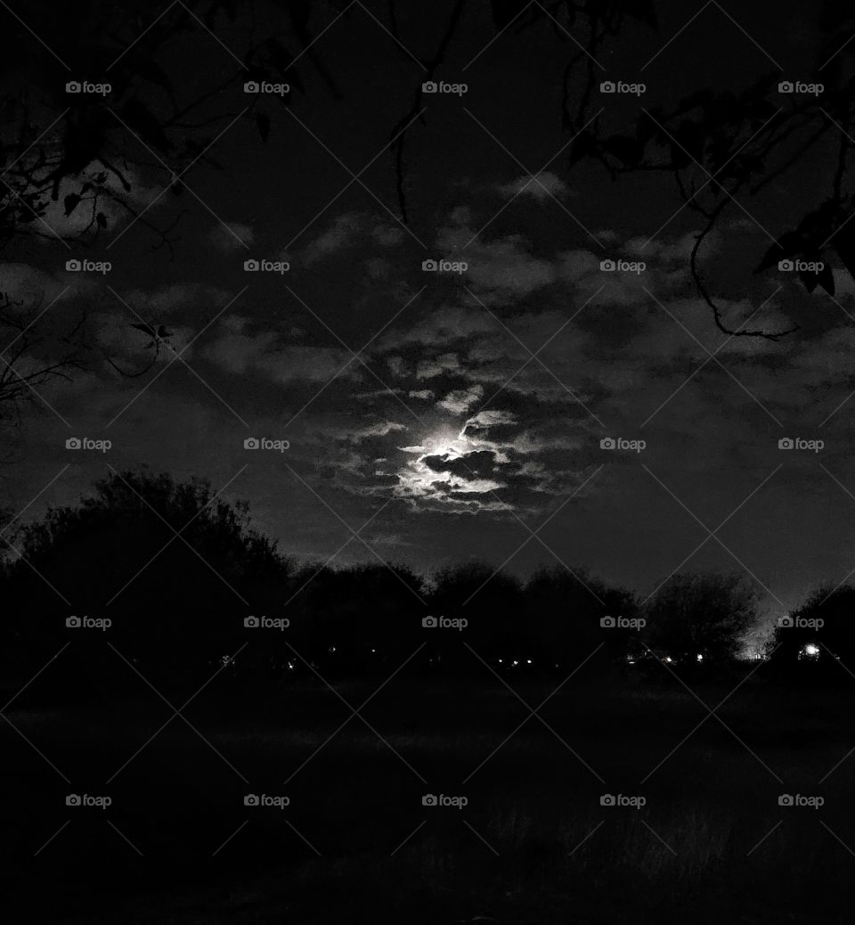 Beautiful full moon, obscured by clouds.