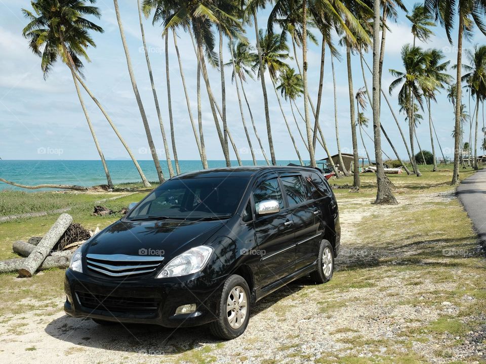 MPV parked near to the beach on a road trip to Terengganu, Malaysia