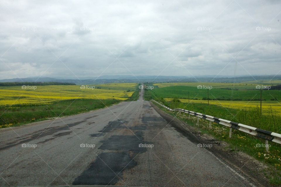 A bad cover of a road with wonderful landscape