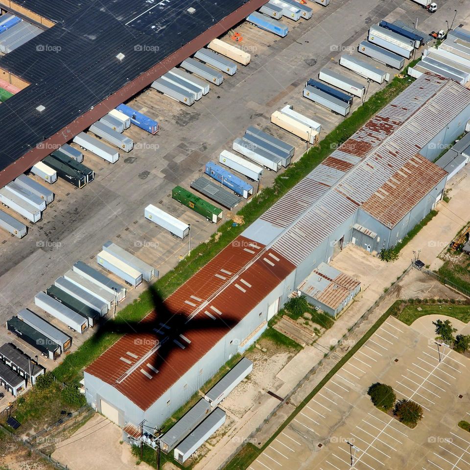 Perfect placement of the sun in relation to the aircraft I'm in produces a sharp silhouette as we are in final approach