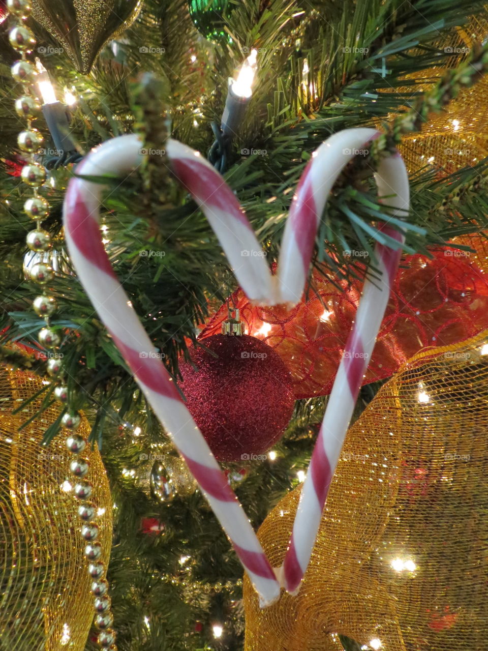 Candy cane heart on a Christmas tree.