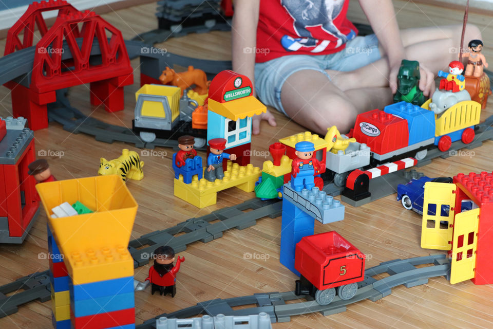 Child playing with Lego Duplo