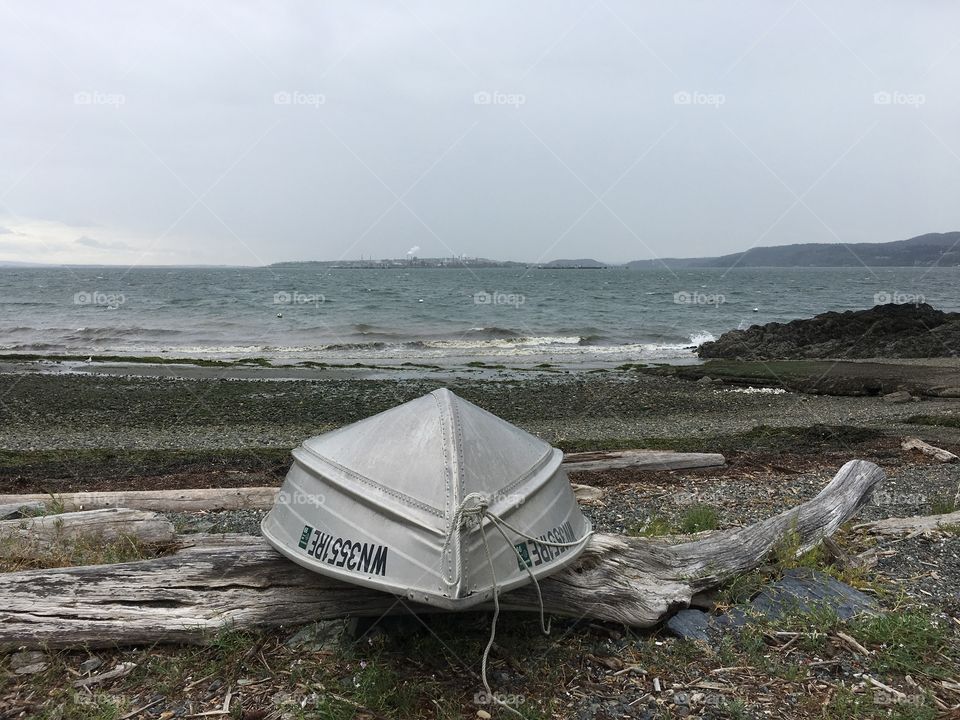 Stormy weather in Guemes Island cove - boat on the beach