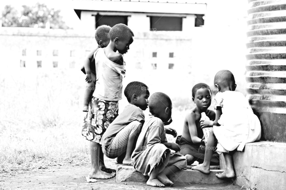 Collecting Water. Local children drinking and collecting clean water 