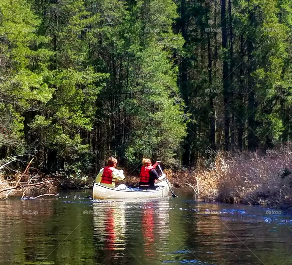 couple canoeing an a spring afternoon