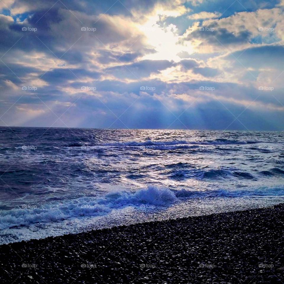 Scenic view of ocean at sunset