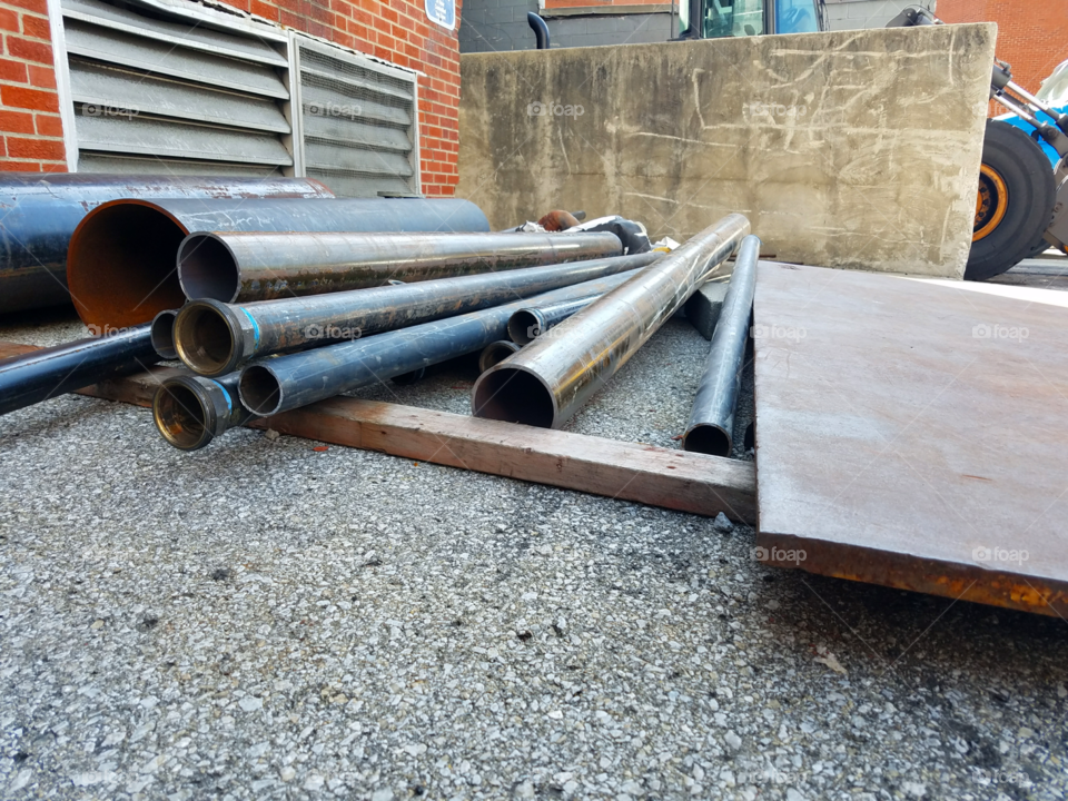 Pipes being pulled and moved on to their next job