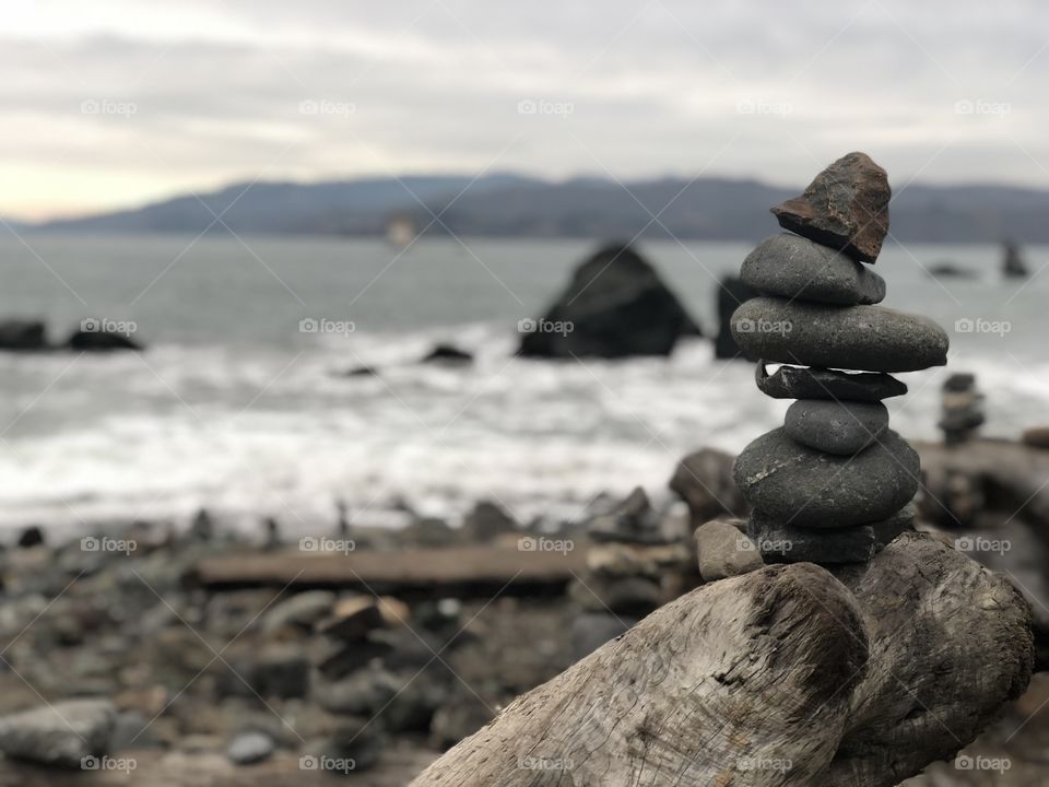 Balancing the rocks by the ocean. No editing needed. The bokeh I love. The ocean is a plus. The people I was with made it all worth it. 