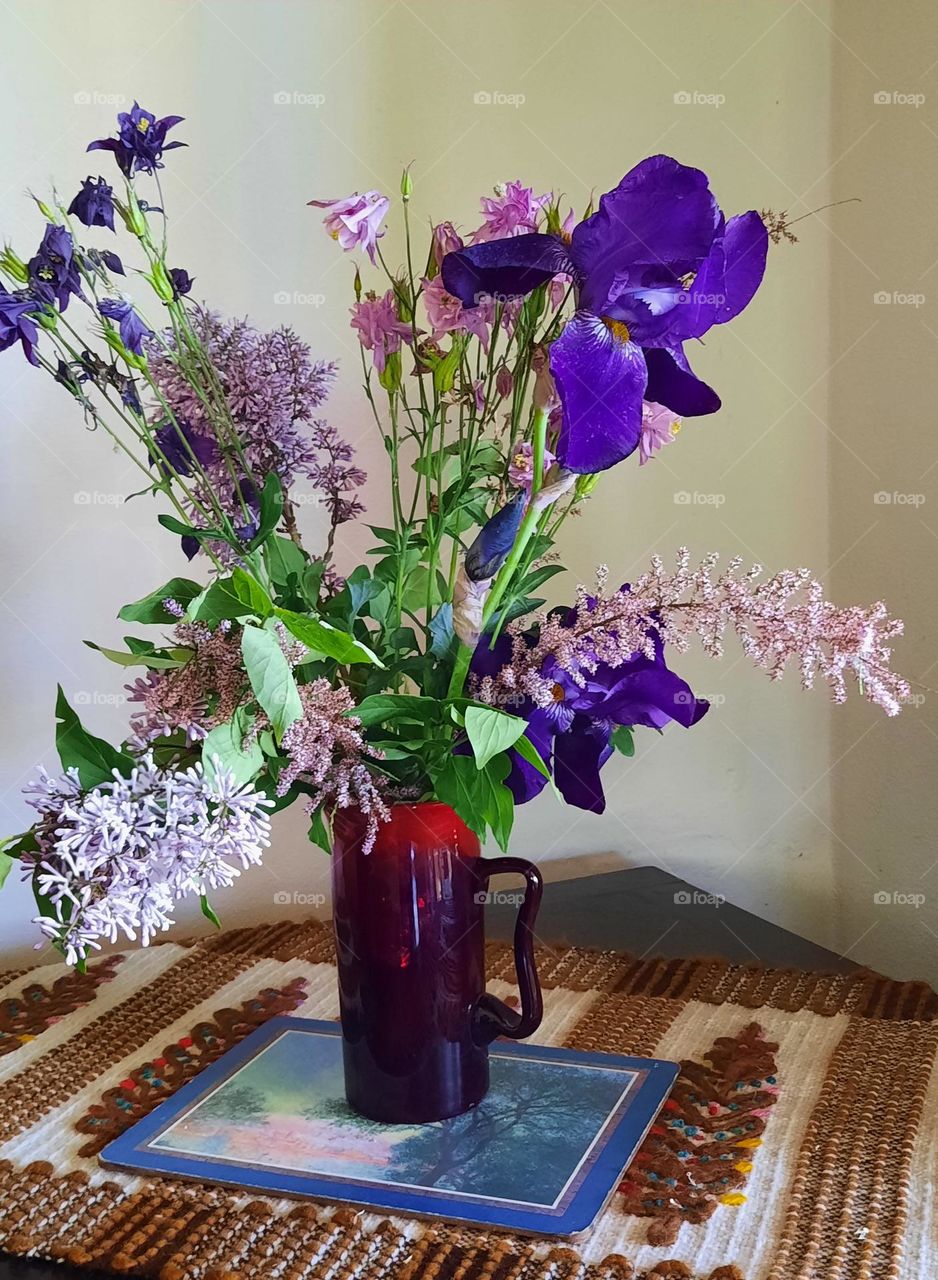 spring flowers in red vase