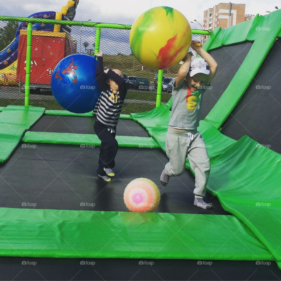 Children having fun . Having fun on trampoline