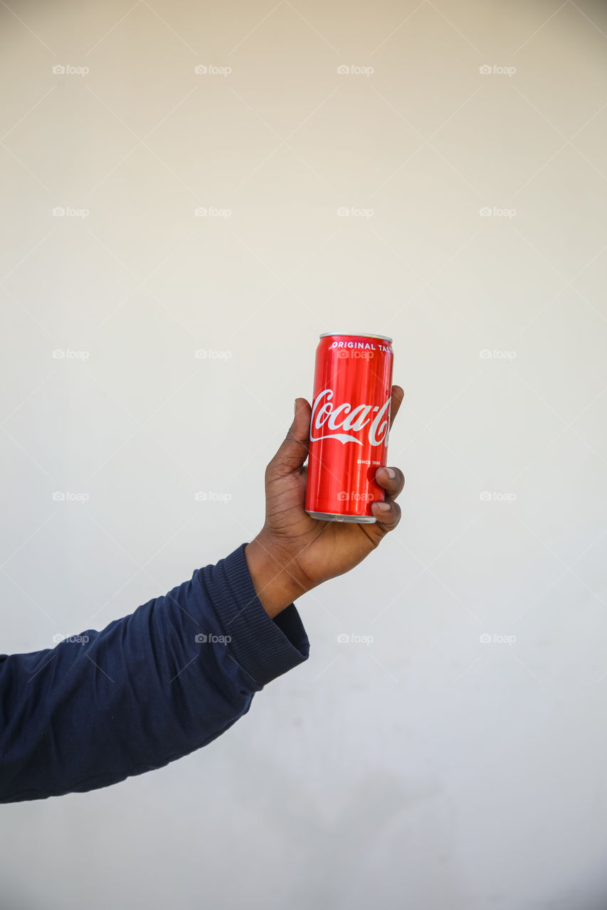 A Friend about to drink his coke