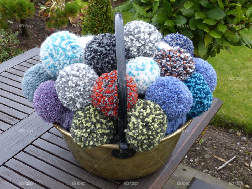 Pan full of pom poms. A vintage jam pan full of my wool and alpaca hand knitted pompom hats