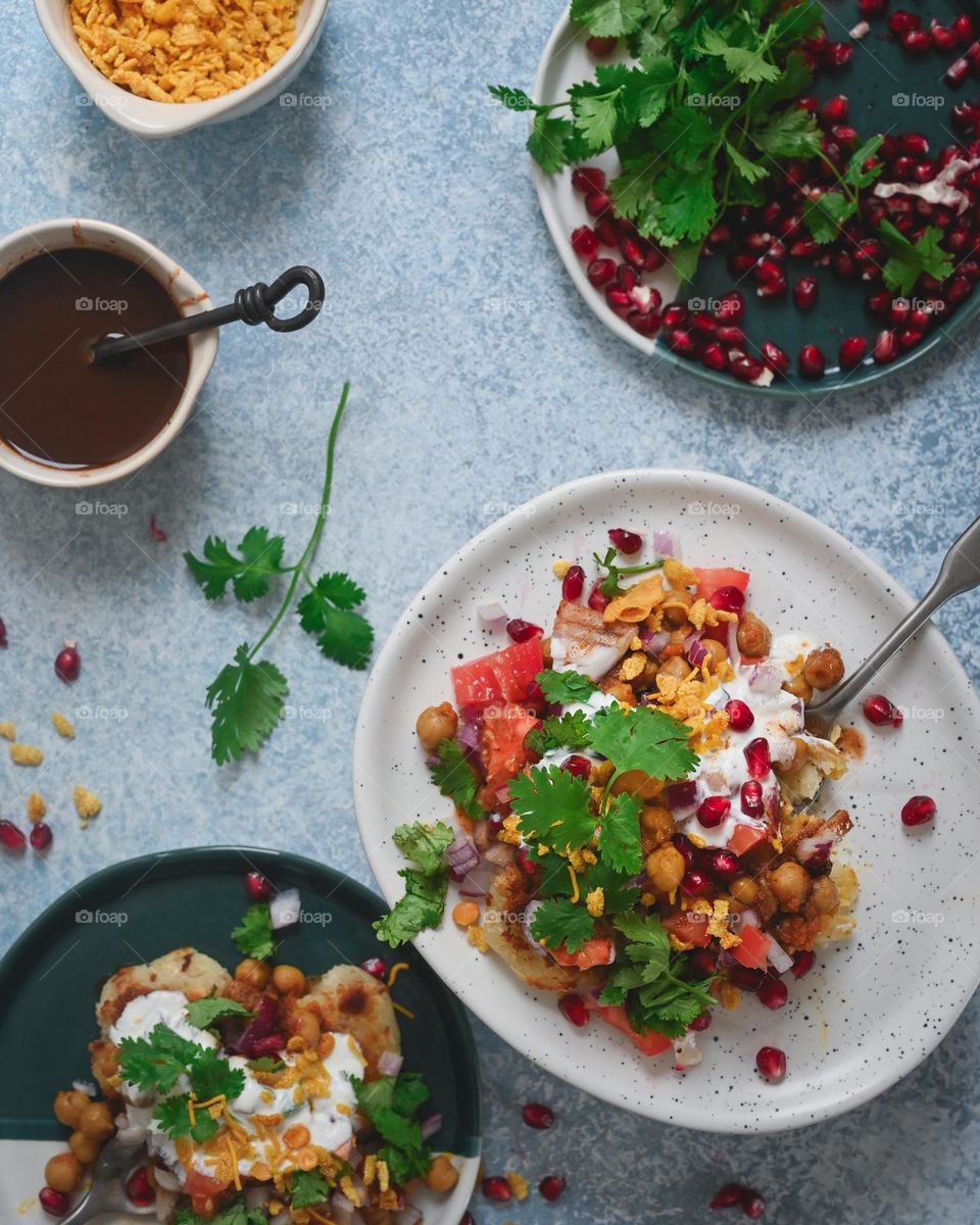 Aloo tikki chana chaat is a popular North Indian snack is full of flavours sweet, tangy, crispy and spicy. Topped with yogurt and chutneys. 