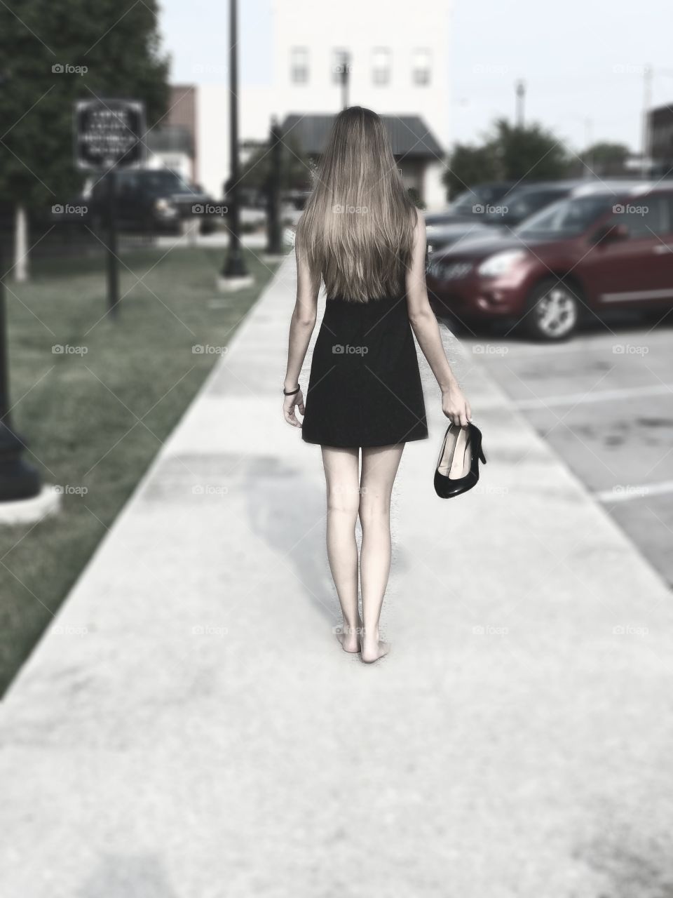 Girl walking without her shoes