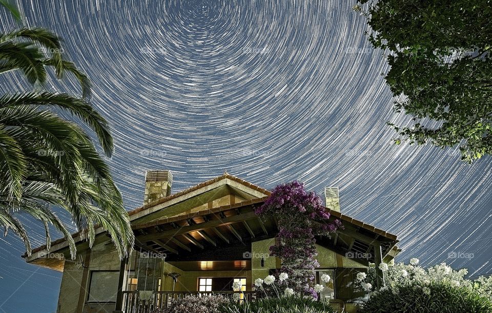 Star Trails over a house in a summer night 