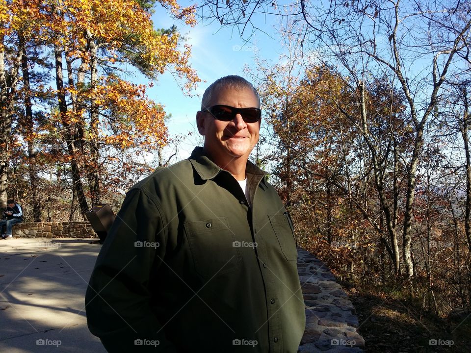 Portrait of a Man in Fall Wearing Sunglasses