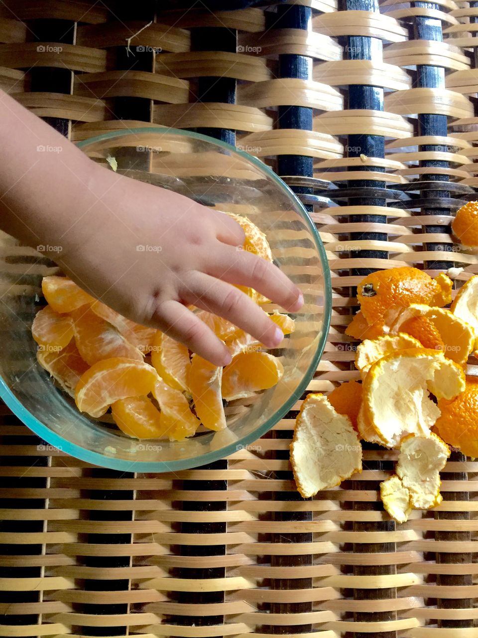 Kid eating orange