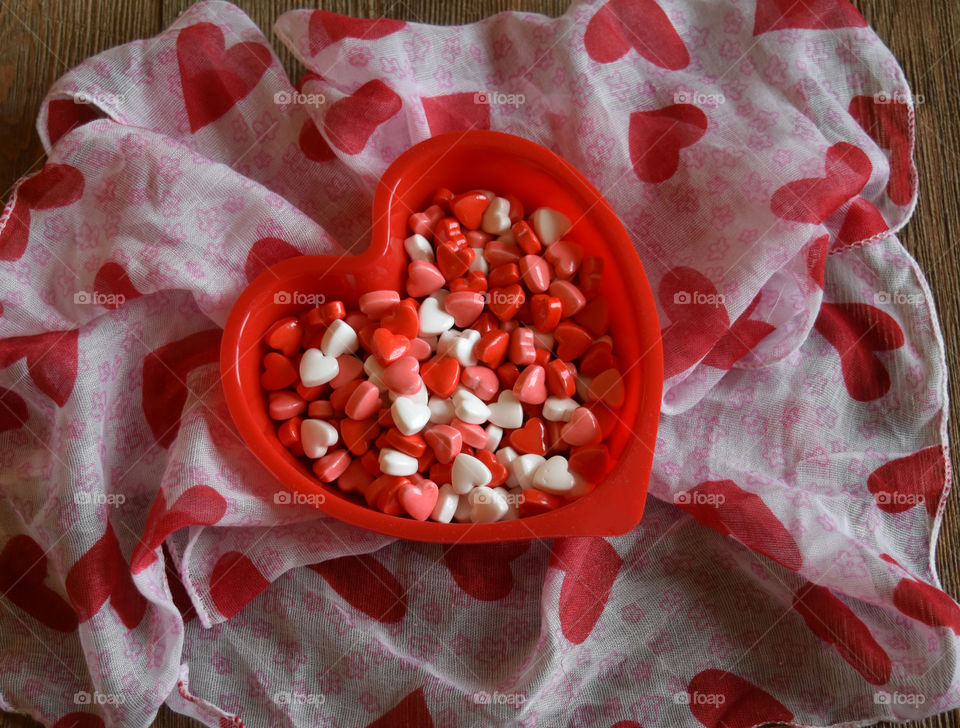 Heart shaped dish full of Valentines candy