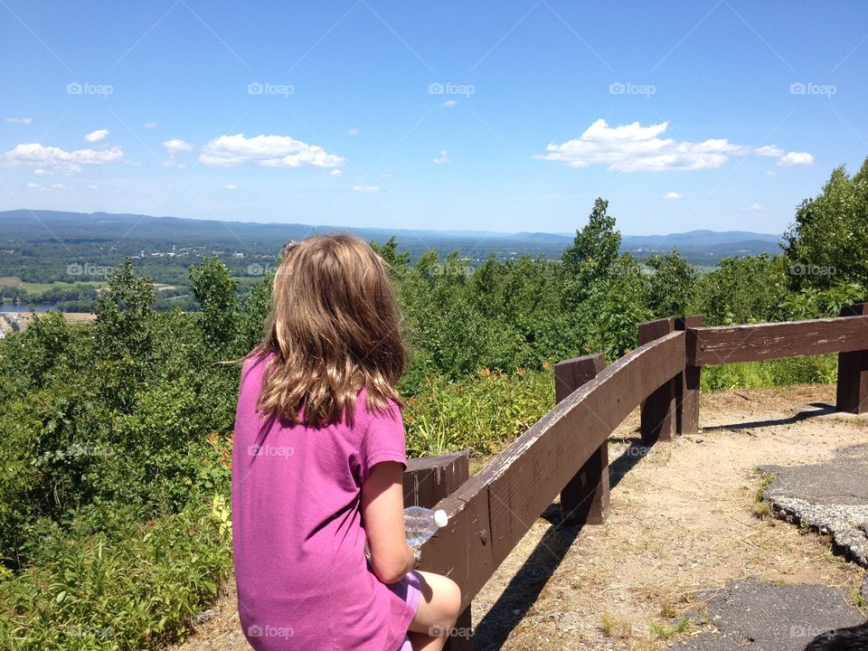 Girl looking out over the valley from the top Mt. Tom