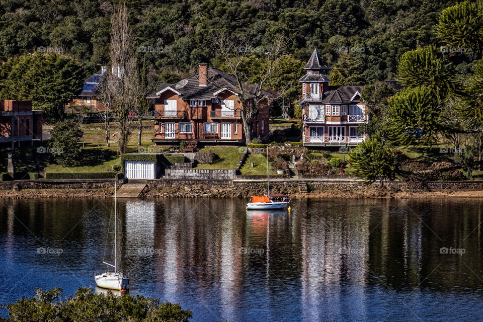 Houses in front of a lake