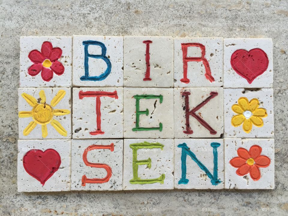 Bir tek sen, only you in turkish language . Carved travertine pieces and turkish sentence bir tek sen meaning only you