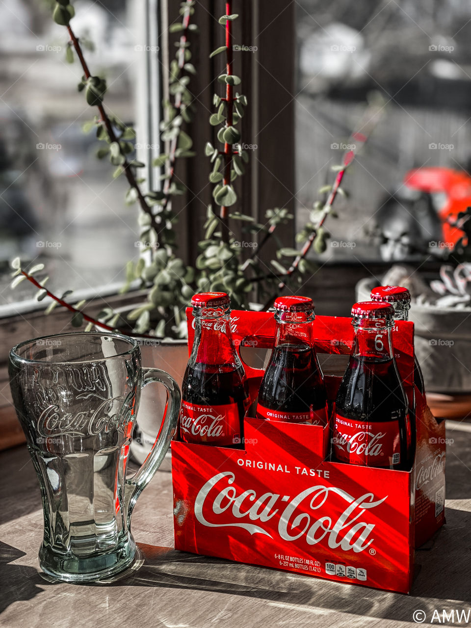 Coca cola by a window 