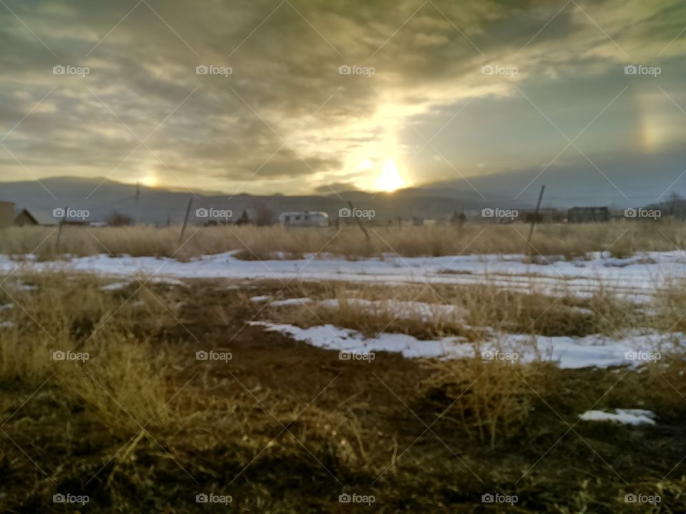 Quiet morning sunrise on snowy high Desert  farm field