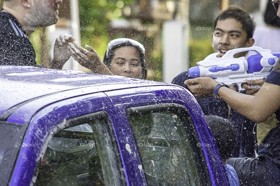 Tourists on the car play water in Songkran festival or Thai new year at Bang kruai, Nonthaburi , April 15, 2019