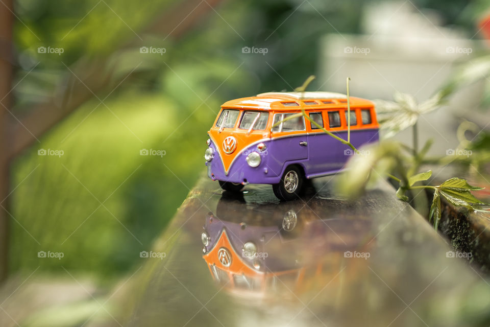 Little orange and purple volkswagen bus model