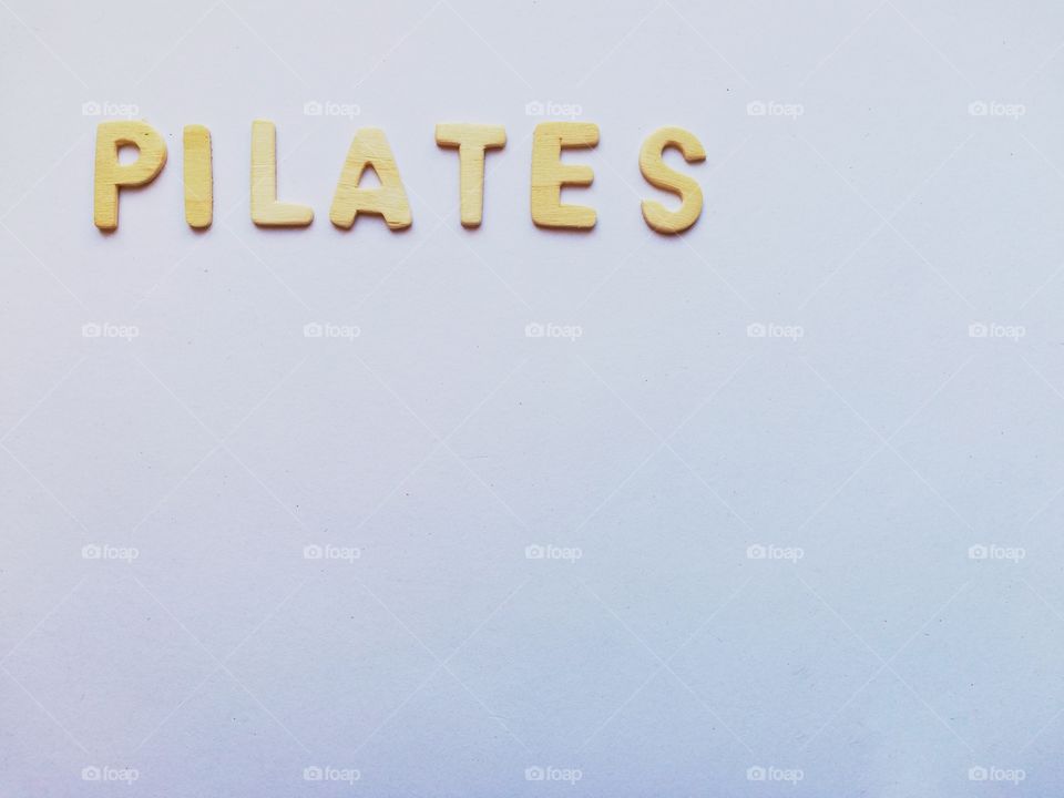 Written: "pilates" on a white background