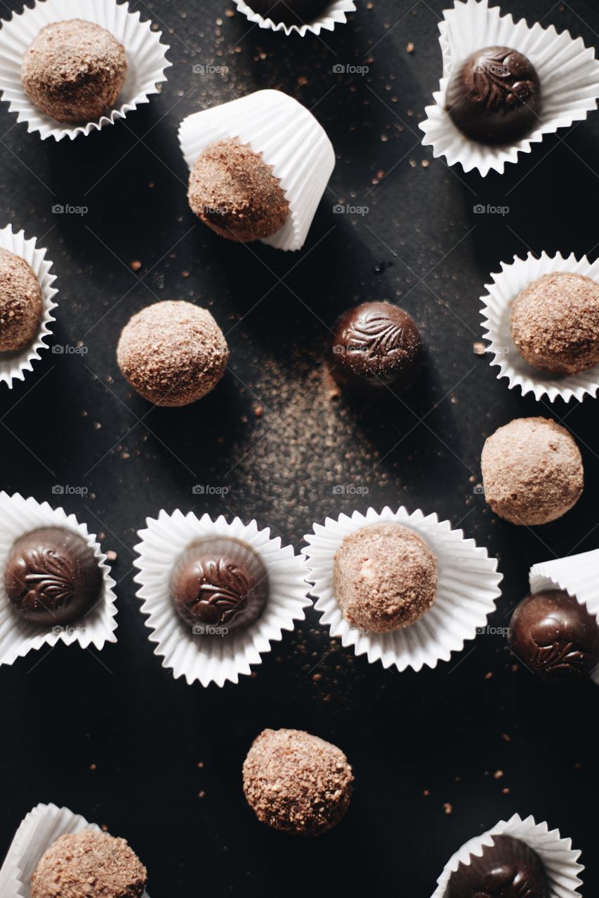 background image of chocolates on a black background