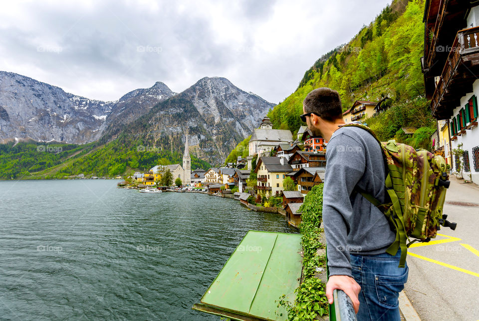 Hiker standing in Hallstatt village near lake