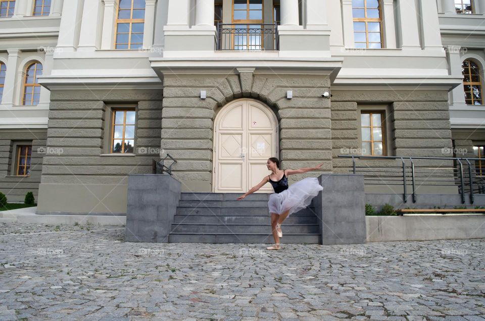 Young Female Ballerina Dancing Outside