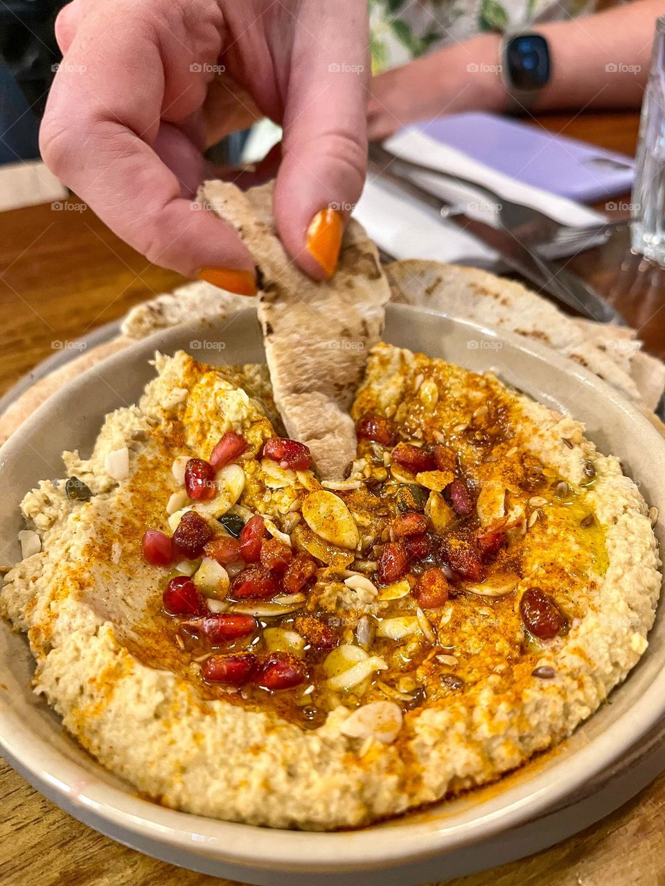 Eating hummus in a restaurant 