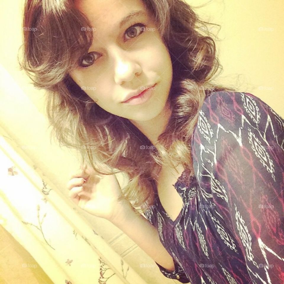 Curly hair and a delicate face