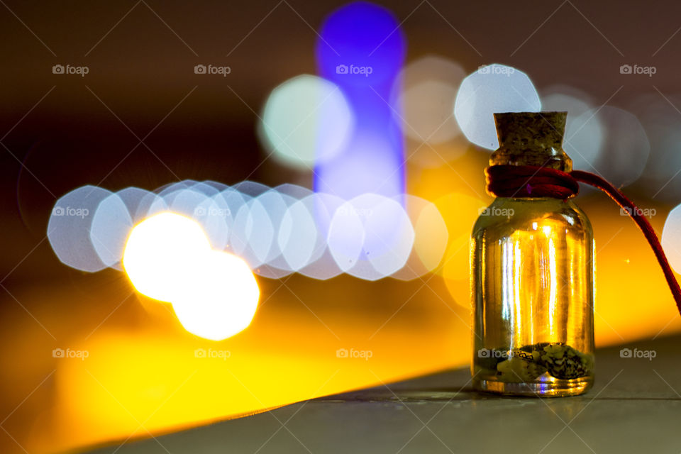 Seashells in glass bottle at night