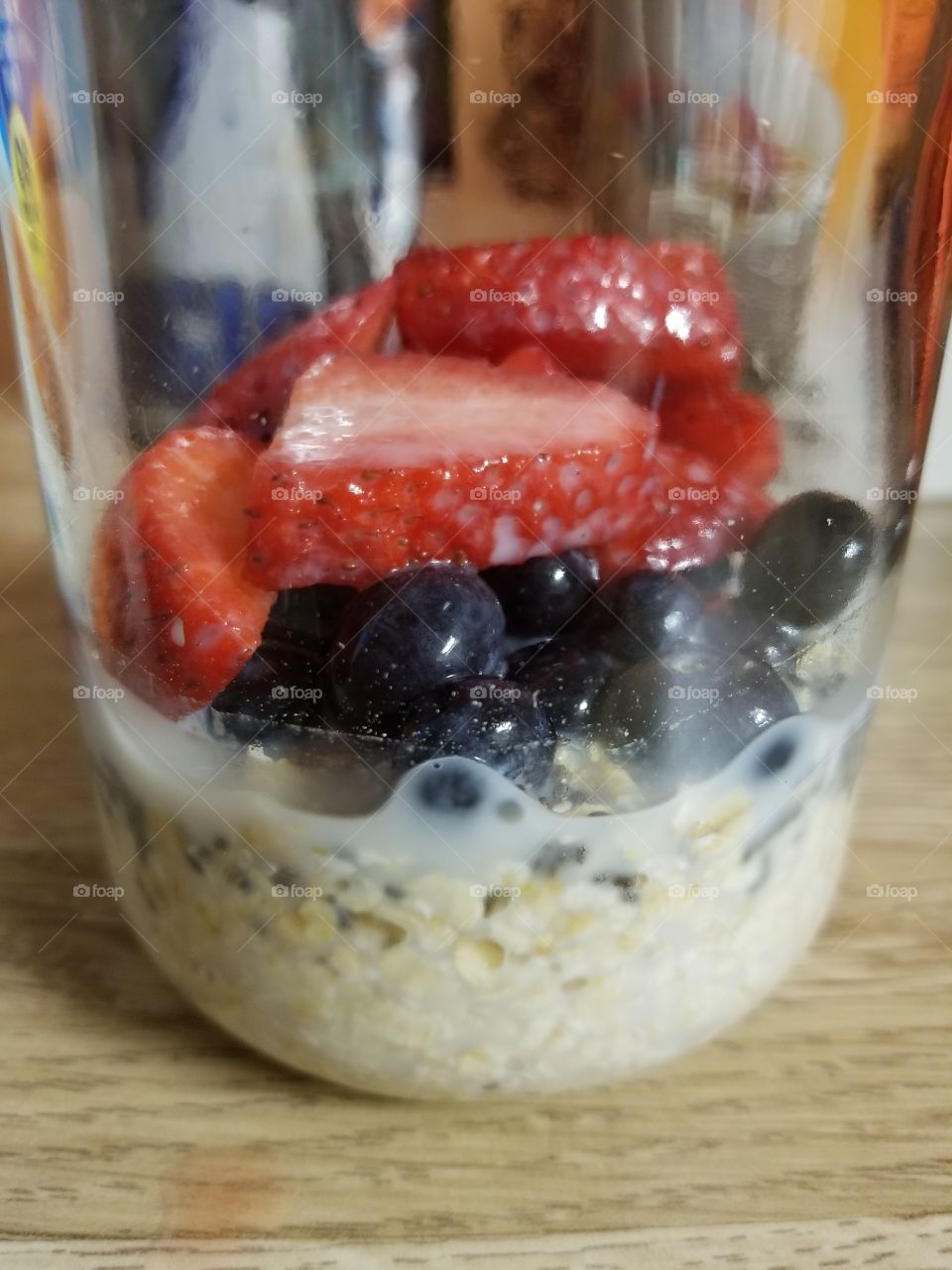 Overnight Oats in a Mason Jar. The perfect healthy breakfast. Berries and almond milk