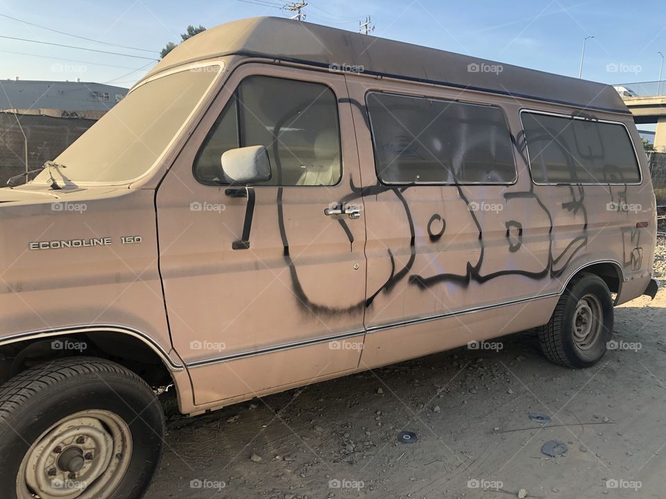Dusty bus on the backroads of the wood street homeless community in Oakland California.