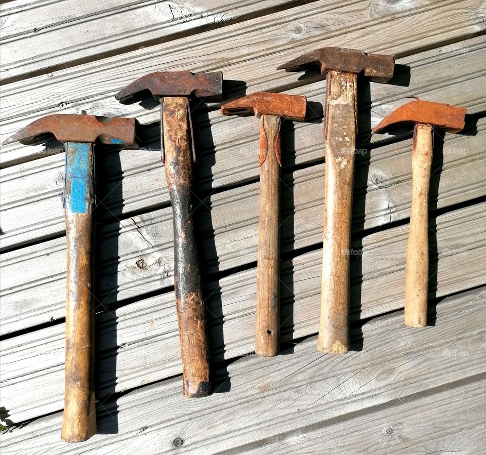 Antique rusty and patinated hammers.