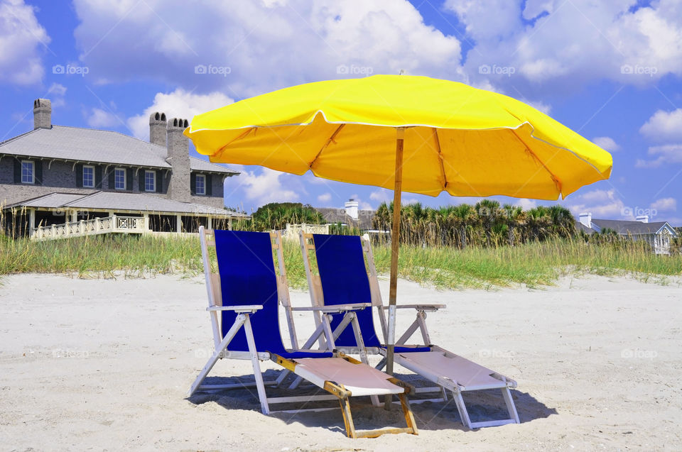 Beach chairs at the seashore.